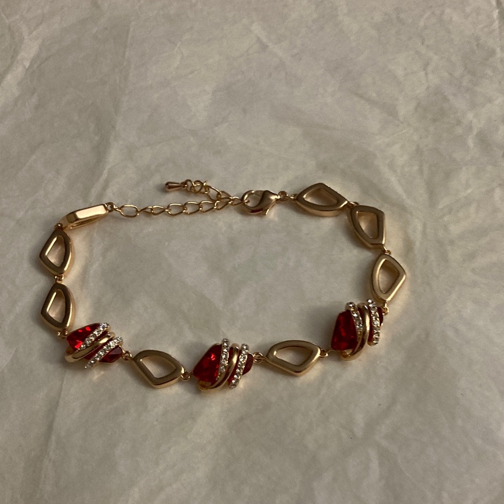 Elegant Gold Bracelet with Red Accents